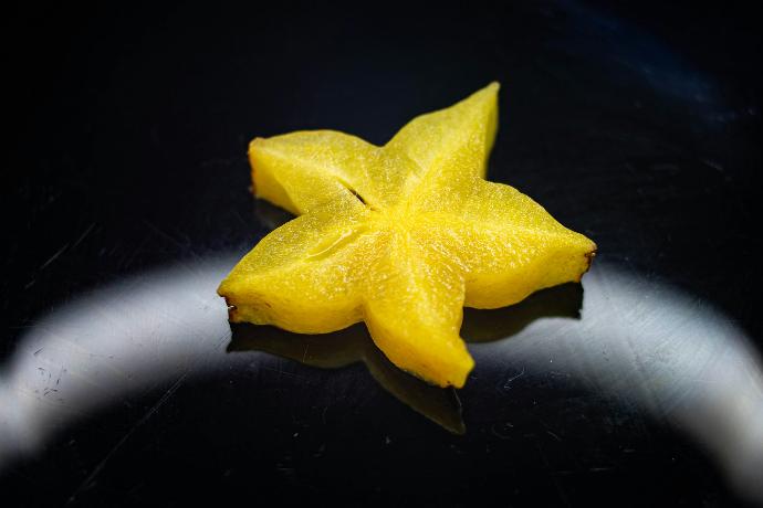 yellow star ornament on black surface